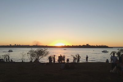 Scenic view of sea against clear sky during sunset