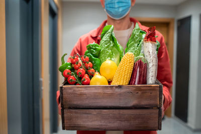 Midsection of woman holding food