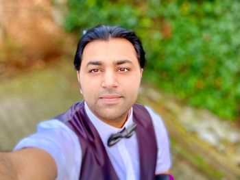 Portrait of young man standing outdoors