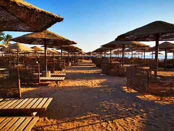 Built structure on beach against clear sky