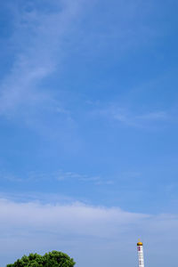 Low angle view of building against blue sky