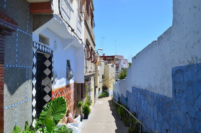 Footpath amidst buildings in town