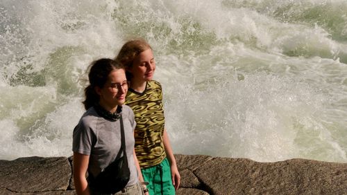 Friends enjoying at sea shore