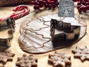 Close-up of cookie dough and cutter on table