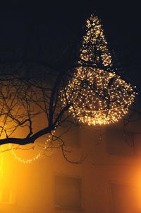 Low angle view of illuminated building at night