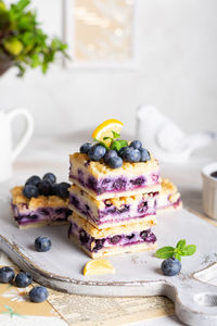 Blueberry pie with cottage cheese on white plate