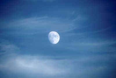 Low angle view of moon against sky at night