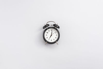 Close-up of pocket watch against white background