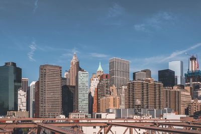 The lower manhattan of new york city as seen from brooklyn bridge