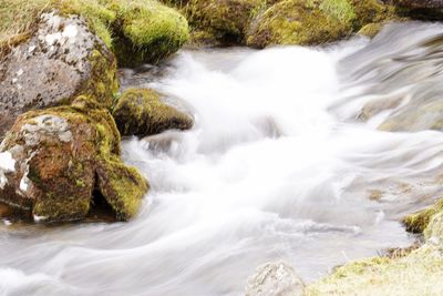 Scenic view of river flowing through rocks