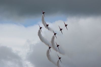 Low angle view of airshow in sky