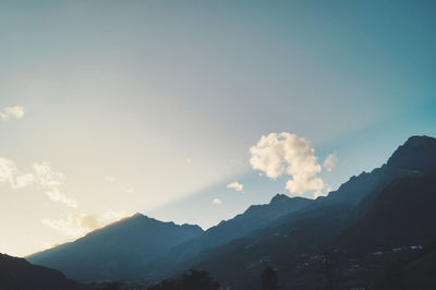 Scenic view of silhouette mountains against sky