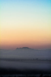 Scenic view of landscape against sky during sunset
