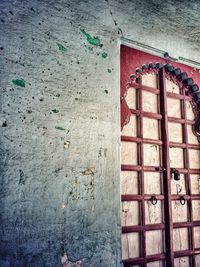 Low angle view of window on old building