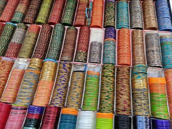 Full frame shot of multi colored bangles for sale in market