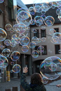 High angle view of woman with bubbles