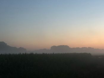 Scenic view of landscape against sky during sunset