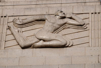 Close-up of statue in front of building