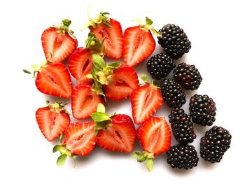 Close-up of fresh fruits against white background