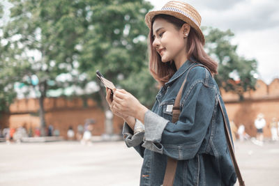 Young woman using mobile phone