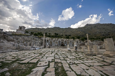 View of old ruins against cloudy sky