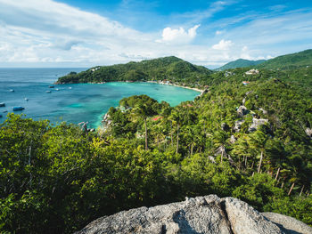 Scenic view of sea and mountains against sky