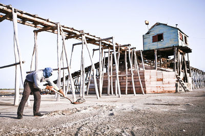 Low angle view of woman against clear sky