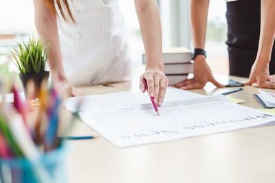 Group of people working on table