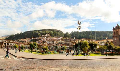 Panoramic view of town against cloudy sky