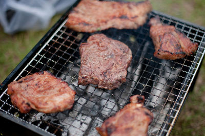 Close-up of meat on barbecue grill