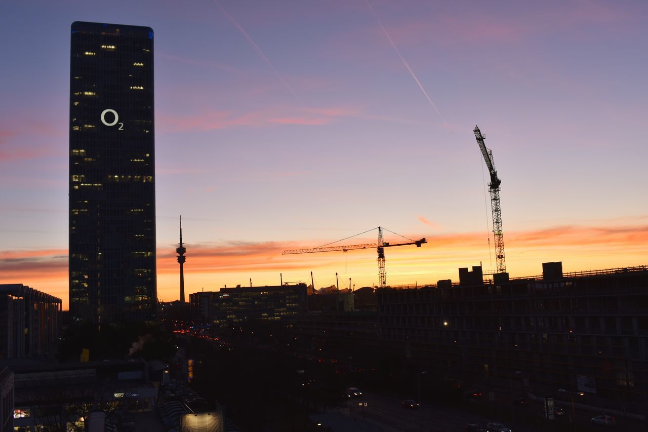 sunset, building exterior, architecture, sky, built structure, city, nature, no people, outdoors, orange color, crane - construction machinery, tower, machinery, illuminated, tall - high, building, cloud - sky, beauty in nature, dusk, industry, skyscraper