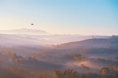 Scenic view of landscape against sky during sunset