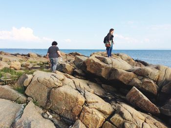 Rear view of man standing on beach