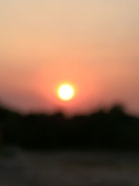 Scenic view of silhouette landscape against romantic sky at sunset