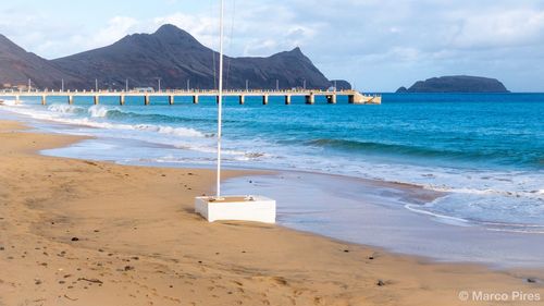 Scenic view of beach against sky