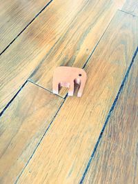 High angle view of information sign on hardwood floor