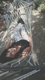 High angle portrait of young woman lying down