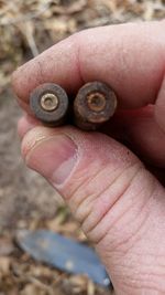 Close-up of hand holding snail