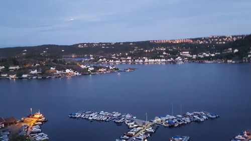 High angle view of harbor and buildings in city