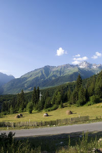 Scenic view of landscape and mountains against sky