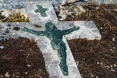 High angle view of angel statue at cemetery