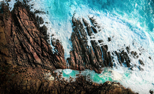 Waves crashing on rocks - aerial view stunning