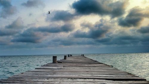 Pier over sea against sky