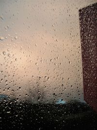 Full frame shot of raindrops on window