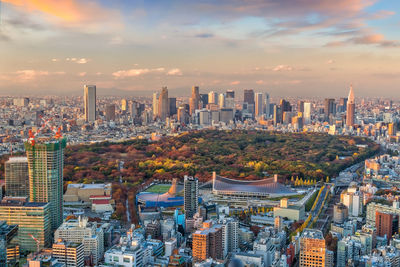 Aerial view of modern buildings in city against sky