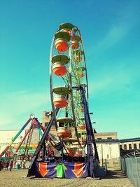 Ferris wheel against blue sky