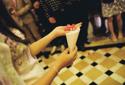 Close-up of hand holding ice cream