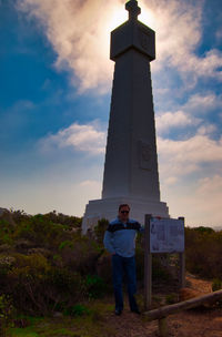 Full length of man standing against sky during sunset
