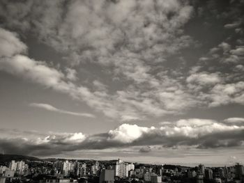 Buildings in city against sky