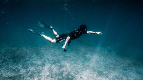 Low angle view of person swimming in sea